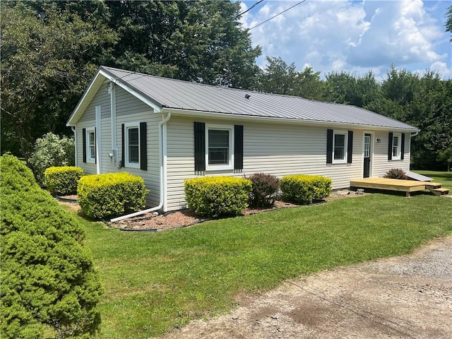55 Evergreen, West Salem Twp, PA 16125 - view of front facade featuring a deck, a front lawn, and a metal roof