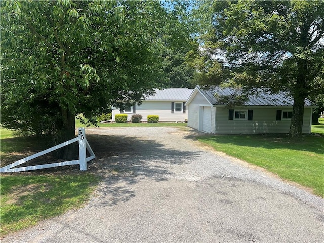 55 Evergreen, West Salem Twp, PA 16125 - view of front of property with driveway, a metal roof, a front lawn, a standing seam roof, and a garage