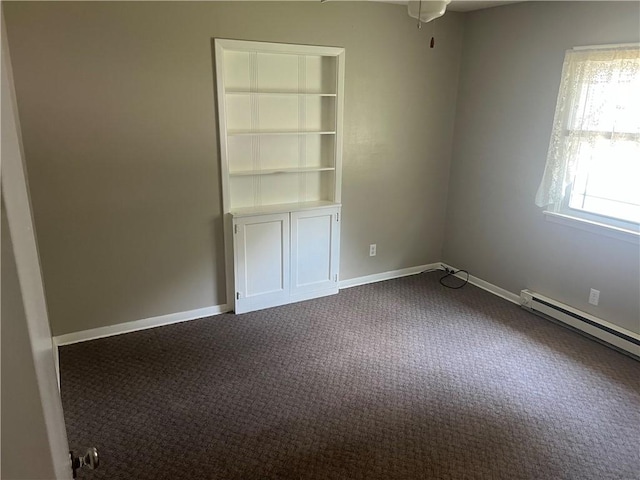 55 Evergreen, West Salem Twp, PA 16125 - spare room featuring dark colored carpet, baseboard heating, ceiling fan, and built in features