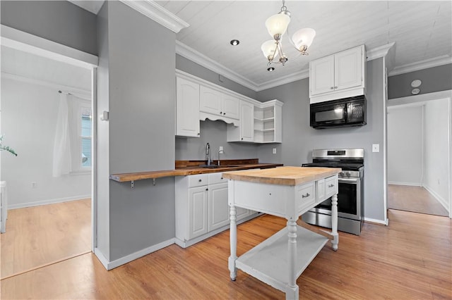 kitchen featuring wooden counters, white cabinetry, black microwave, open shelves, and stainless steel electric stove