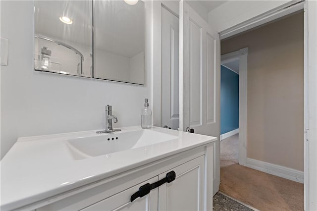 bathroom with baseboards and vanity