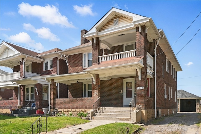 7447 Schoyer Ave, Swissvale, PA 15218 - view of front of house featuring covered porch, a chimney, an outdoor structure, brick siding, and a balcony