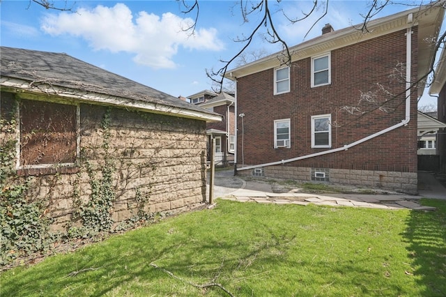 7447 Schoyer Ave, Swissvale, PA 15218 - exterior space with brick siding and a yard