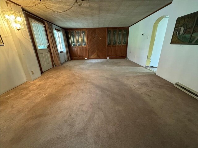 966 Fayette City Rd, Fayette City, PA 15438 - unfurnished living room with arched walkways and light colored carpet