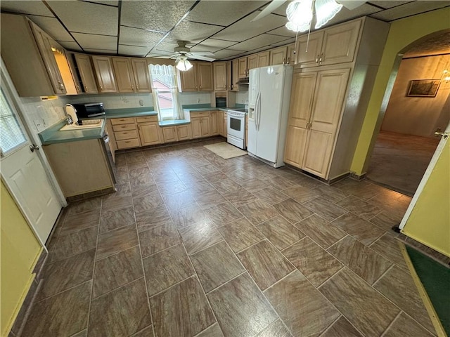 966 Fayette City Rd, Fayette City, PA 15438 - kitchen with a sink, white appliances, ceiling fan, arched walkways, and a paneled ceiling