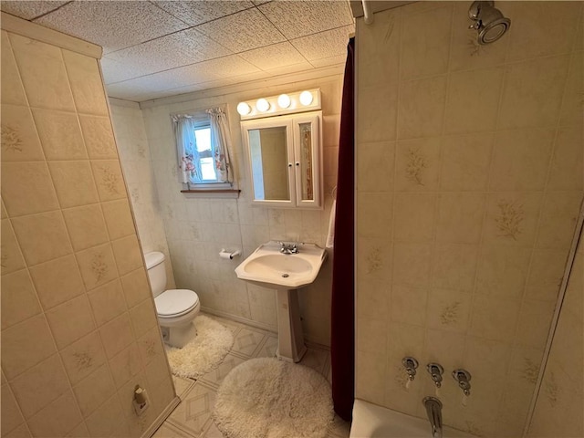 966 Fayette City Rd, Fayette City, PA 15438 - full bath with toilet, tile patterned flooring, a sink, and tile walls
