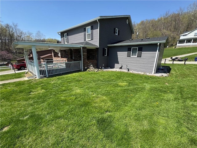 966 Fayette City Rd, Fayette City, PA 15438 - rear view of property with brick siding, a yard, and a porch