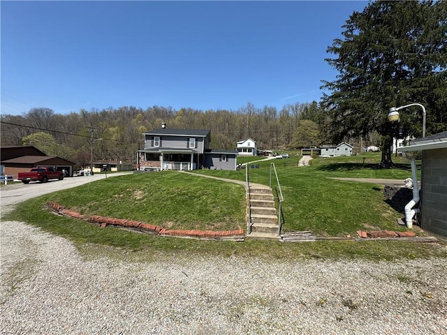 966 Fayette City Rd, Fayette City, PA 15438 - exterior space featuring a forest view and a lawn