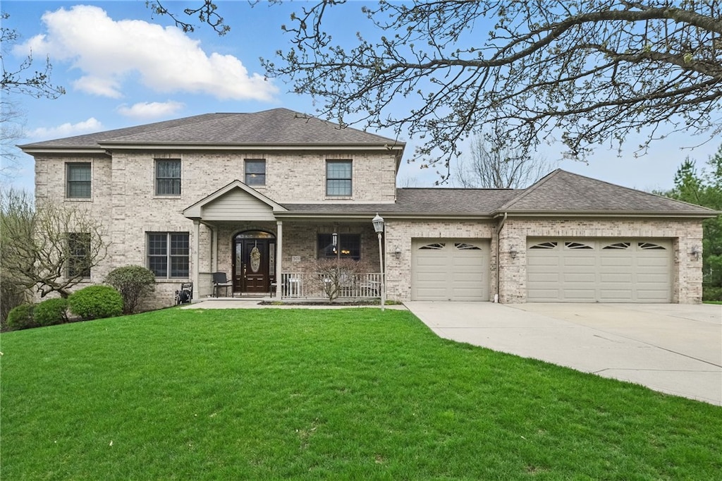 301 Schlag Ct, Ross Twp, PA 15237 - view of front of house featuring driveway, a front yard, a garage, brick siding, and a porch