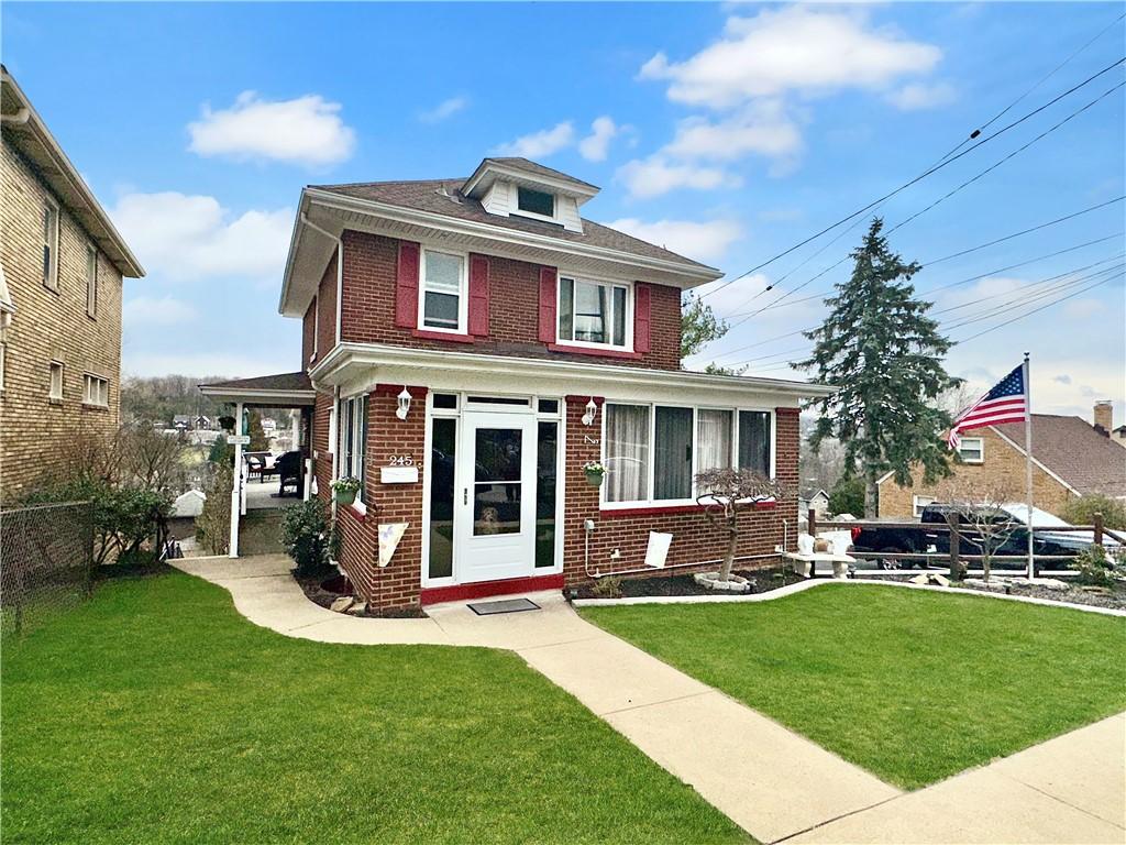 245 Richfield St, Overbrook, PA 15234 - american foursquare style home featuring brick siding, a front lawn, and fence