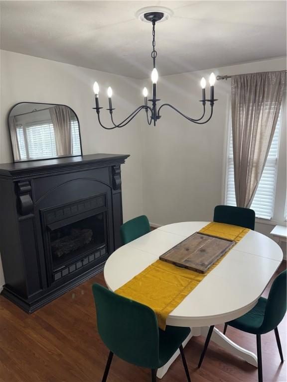 5 Trotwood Cir, North Strabane, PA 15317 - dining room with a fireplace, a chandelier, and wood finished floors