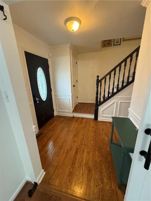 5 Trotwood Cir, North Strabane, PA 15317 - entrance foyer with wood finished floors, stairway, a textured ceiling, a decorative wall, and baseboards