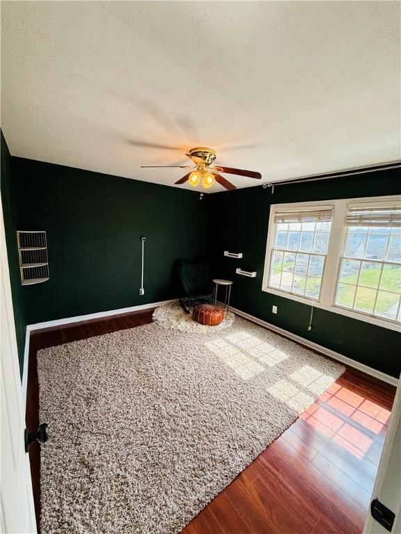 5 Trotwood Cir, North Strabane, PA 15317 - unfurnished room with wood finished floors, ceiling fan, and baseboards
