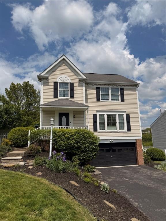 5 Trotwood Cir, North Strabane, PA 15317 - view of front facade featuring a garage and driveway
