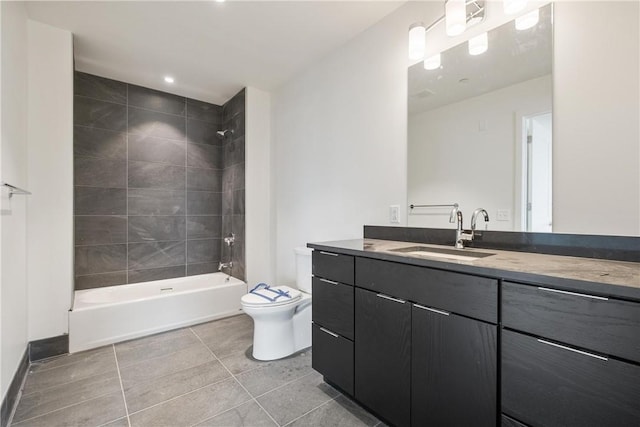 full bath with tile patterned floors, shower / bathtub combination, vanity, and toilet