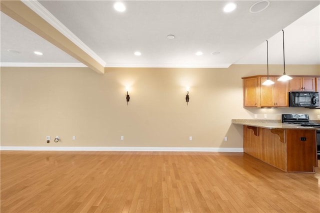 1728 Waterleaf Dr, Franklin Park, PA 15143 - kitchen featuring light wood-style floors, a kitchen bar, brown cabinetry, black microwave, and stainless steel gas range oven