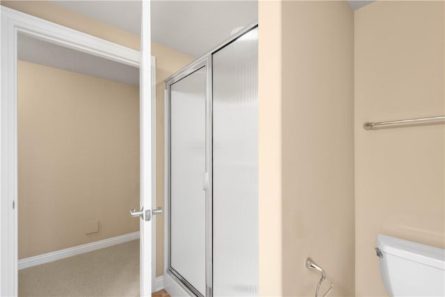 1728 Waterleaf Dr, Franklin Park, PA 15143 - bathroom featuring toilet, a shower with shower door, and baseboards