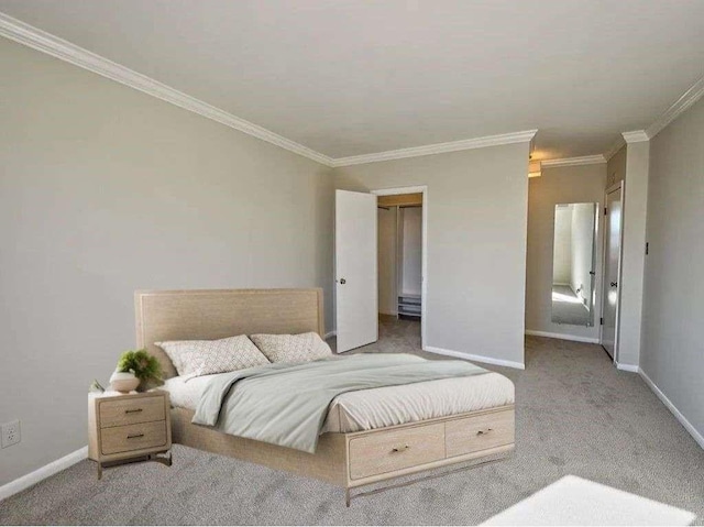 carpeted bedroom with baseboards and crown molding