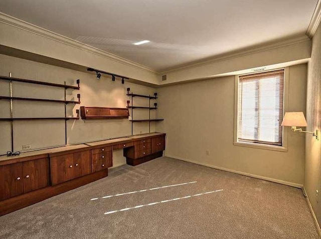 unfurnished office featuring baseboards, visible vents, ornamental molding, and carpet flooring