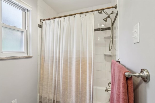 bathroom with shower / bathtub combination with curtain