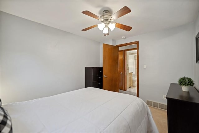 bedroom featuring light carpet, baseboards, a ceiling fan, and visible vents