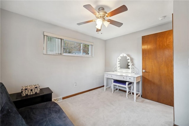 sitting room with ceiling fan, carpet flooring, baseboards, and visible vents