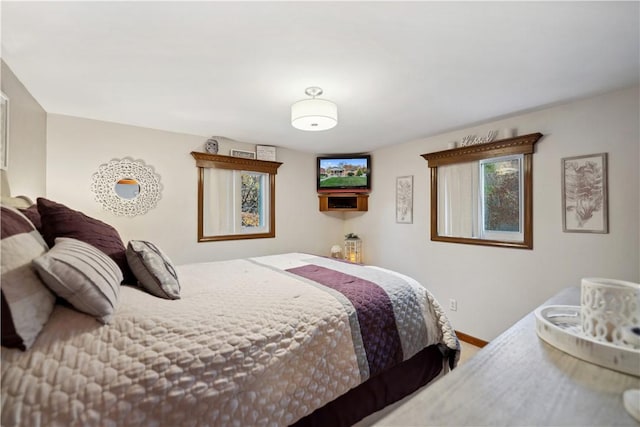 bedroom featuring baseboards