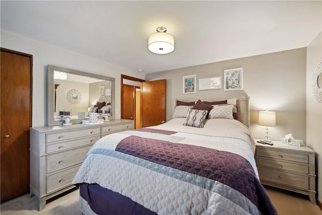 bedroom with light colored carpet