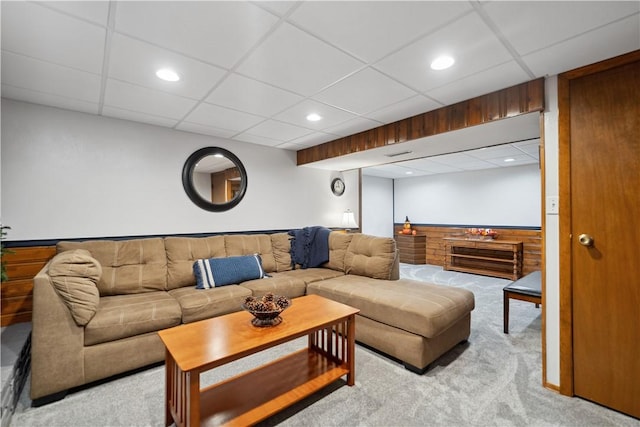 living room with recessed lighting, a paneled ceiling, and light colored carpet