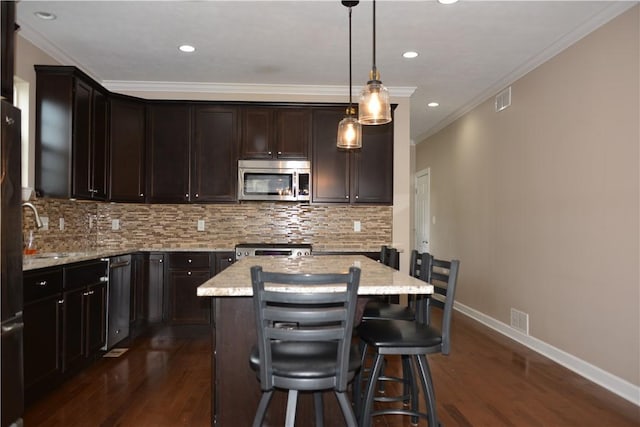 395 Wealdstone Rd, Cranberry Twp, PA 16066 - kitchen with appliances with stainless steel finishes, dark wood-style flooring, tasteful backsplash, dark brown cabinetry, and ornamental molding