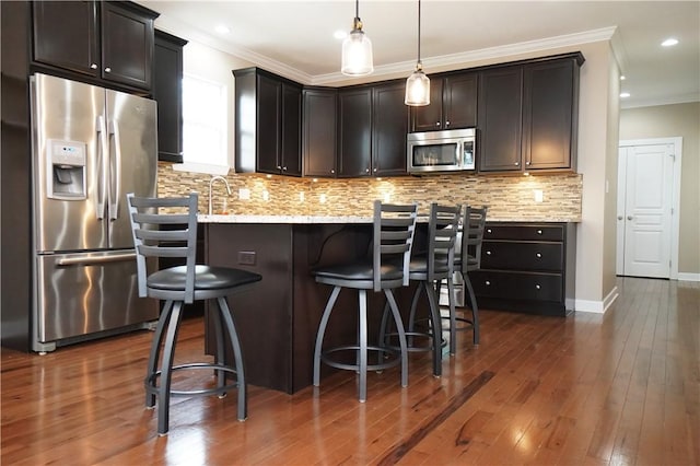 395 Wealdstone Rd, Cranberry Twp, PA 16066 - kitchen featuring stainless steel appliances, crown molding, decorative backsplash, a kitchen breakfast bar, and light stone counters