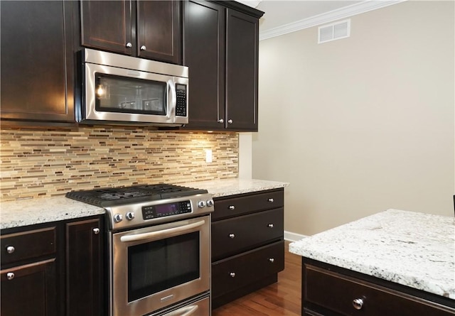 395 Wealdstone Rd, Cranberry Twp, PA 16066 - kitchen with appliances with stainless steel finishes, tasteful backsplash, crown molding, light stone countertops, and dark wood-style flooring