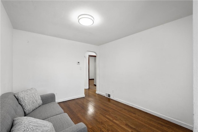 63 Lawn St, Oakland, PA 15213 - sitting room featuring visible vents, baseboards, arched walkways, and wood finished floors