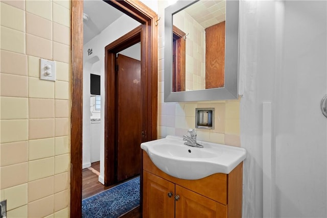 63 Lawn St, Oakland, PA 15213 - bathroom with tile walls, vanity, and wood finished floors