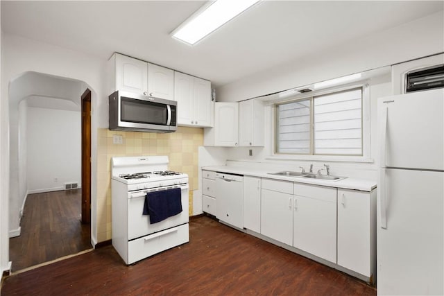 63 Lawn St, Oakland, PA 15213 - kitchen with white appliances, white cabinets, light countertops, a sink, and backsplash