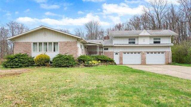 view of front of property featuring concrete driveway, a garage, a front yard, and brick siding