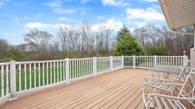 deck featuring a lawn