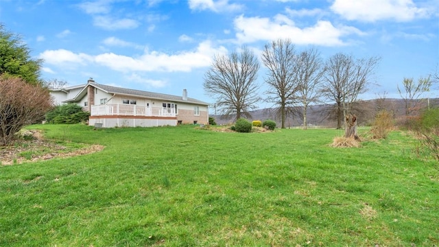 view of yard with a deck