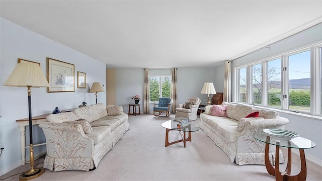 living room with carpet flooring and baseboards