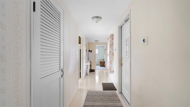 hallway featuring light tile patterned flooring