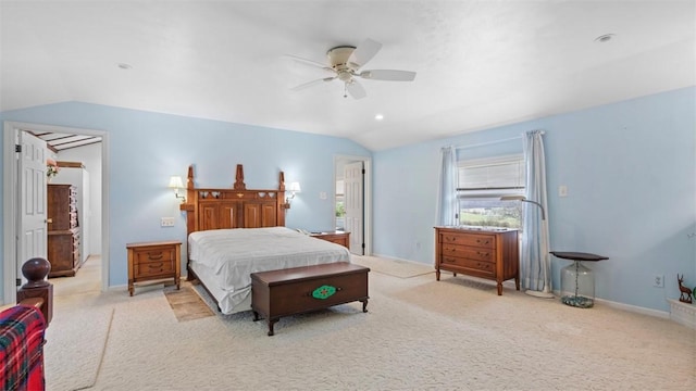 carpeted bedroom featuring baseboards, vaulted ceiling, and ceiling fan