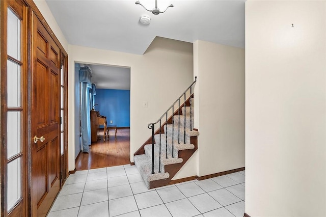 4726 W Barlind Dr, Whitehall, PA 15227 - foyer featuring stairway, light tile patterned floors, and baseboards