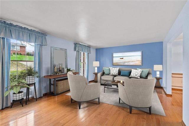 4726 W Barlind Dr, Whitehall, PA 15227 - living room featuring light wood-type flooring and baseboards