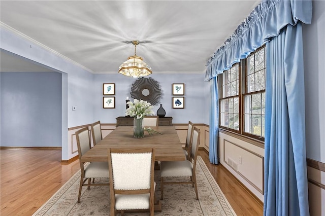 4726 W Barlind Dr, Whitehall, PA 15227 - dining room featuring light wood-style floors and crown molding