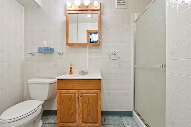 4726 W Barlind Dr, Whitehall, PA 15227 - full bath with tile walls, vanity, toilet, a stall shower, and tile patterned flooring