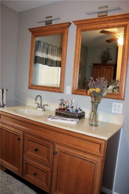 bathroom featuring vanity and ceiling fan