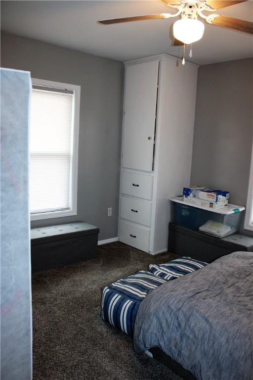 carpeted bedroom featuring ceiling fan