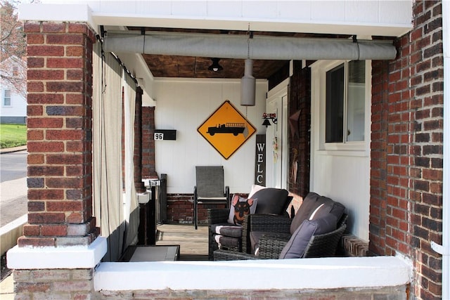 doorway to property featuring brick siding