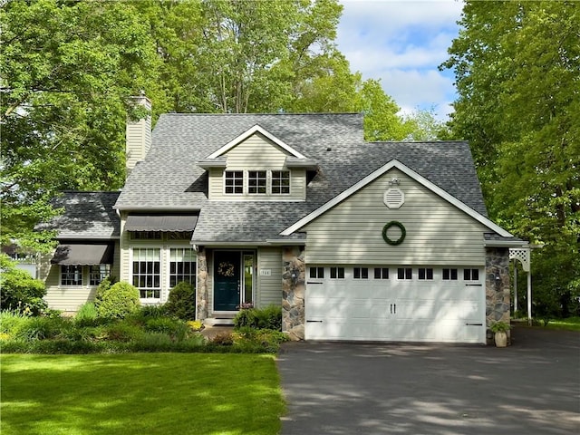 788 Latonka Dr, Coolspring Twp, PA 16137 - view of front of house featuring roof with shingles, driveway, a chimney, stone siding, and a front yard