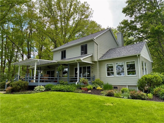 788 Latonka Dr, Coolspring Twp, PA 16137 - view of front of home with ceiling fan, a front yard, a shingled roof, and a chimney